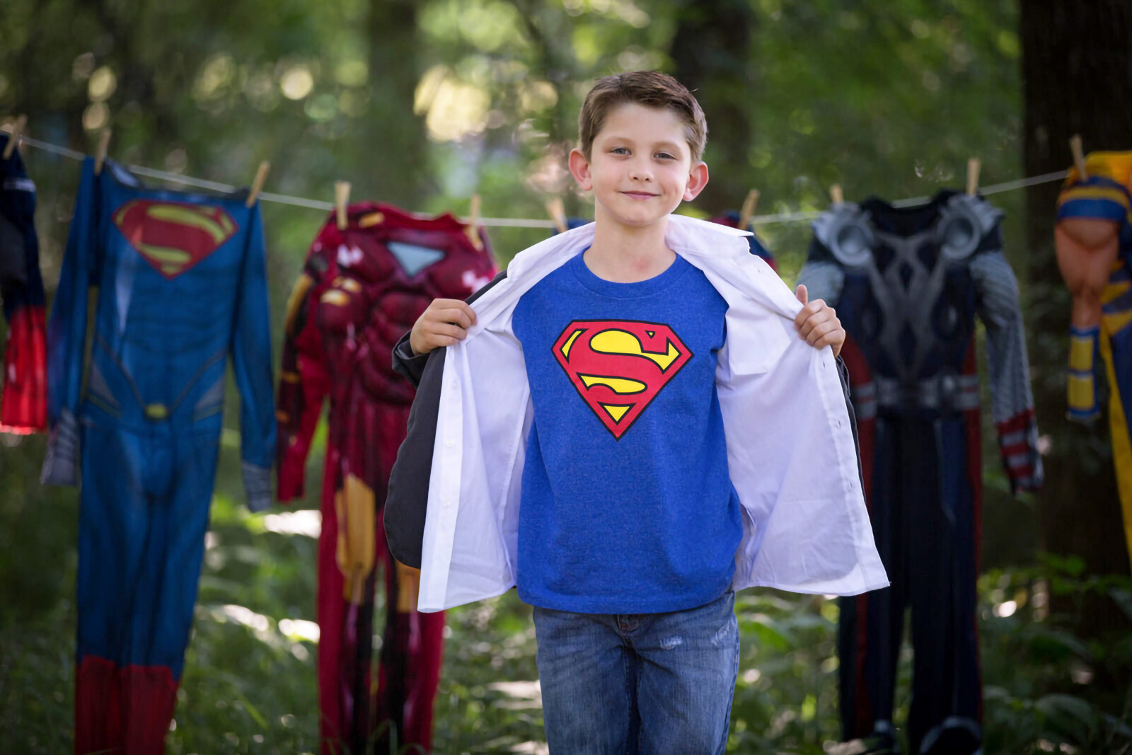 Young boy dressed as superman fine art princess and superhero photography