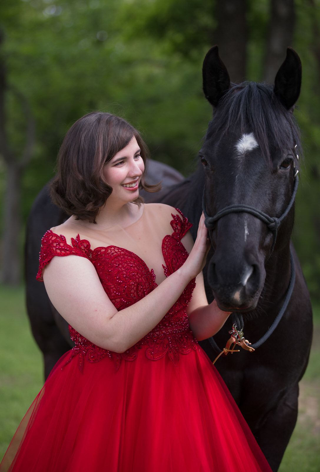 Girl in red dress with black horse portrait session